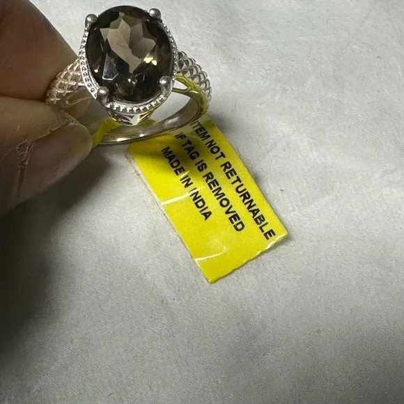 This is a sterling silver ring featuring a smoky quartz gemstone